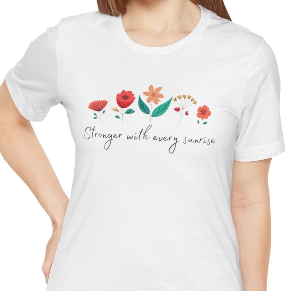 white female t shirt with red flowers design, great gift to wom empowerment occasions, stronger with every sunrise design is also nice as a get well soon present for loved one or friend