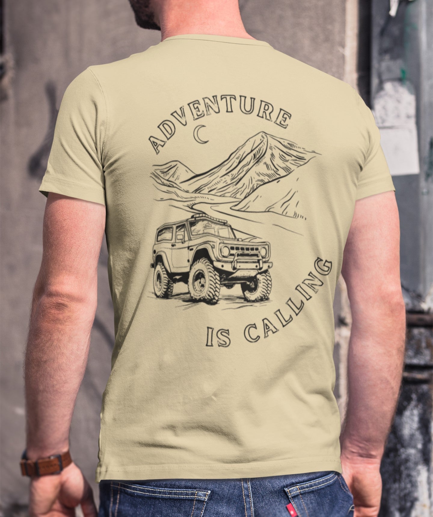 Adventure is calling t-shirt, young man wearing t-shirt showing mountains and off road suv driving in desert , jeep, traveling